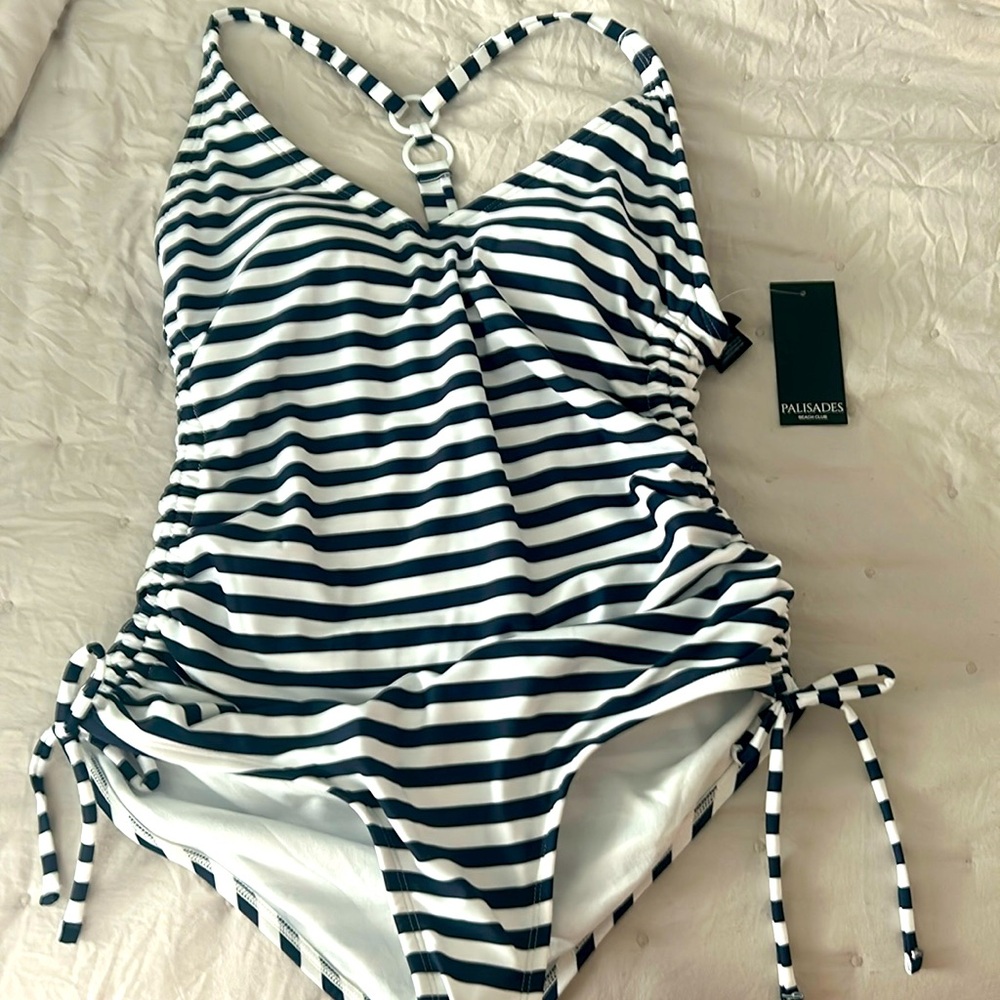 Nice navy & white striped 1 piece bath suit , I bought the wrong size